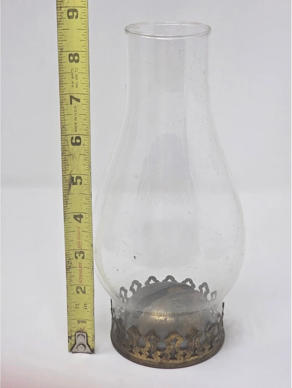 Clear Glass Oil Lamp Chimney With Ornate Brass Tone Pierced Metal Base